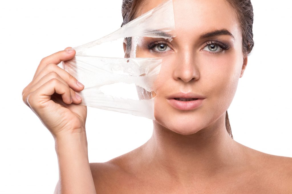 Young woman with purifying Mask on her face